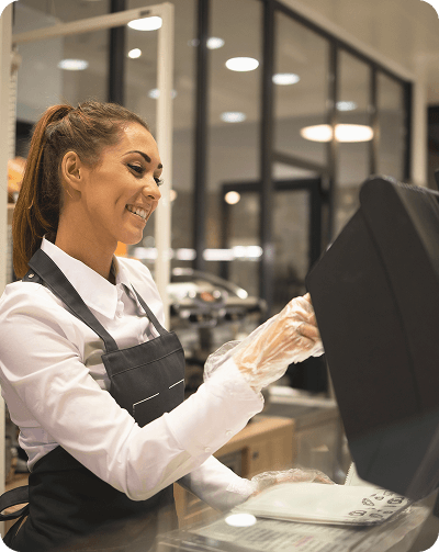 A restaurant worker using a point of sale terminal